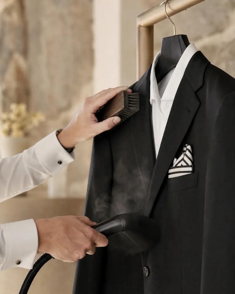 Professional garment care on a tailored black blazer